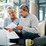 Shot of a mature couple going through paperwork together at home